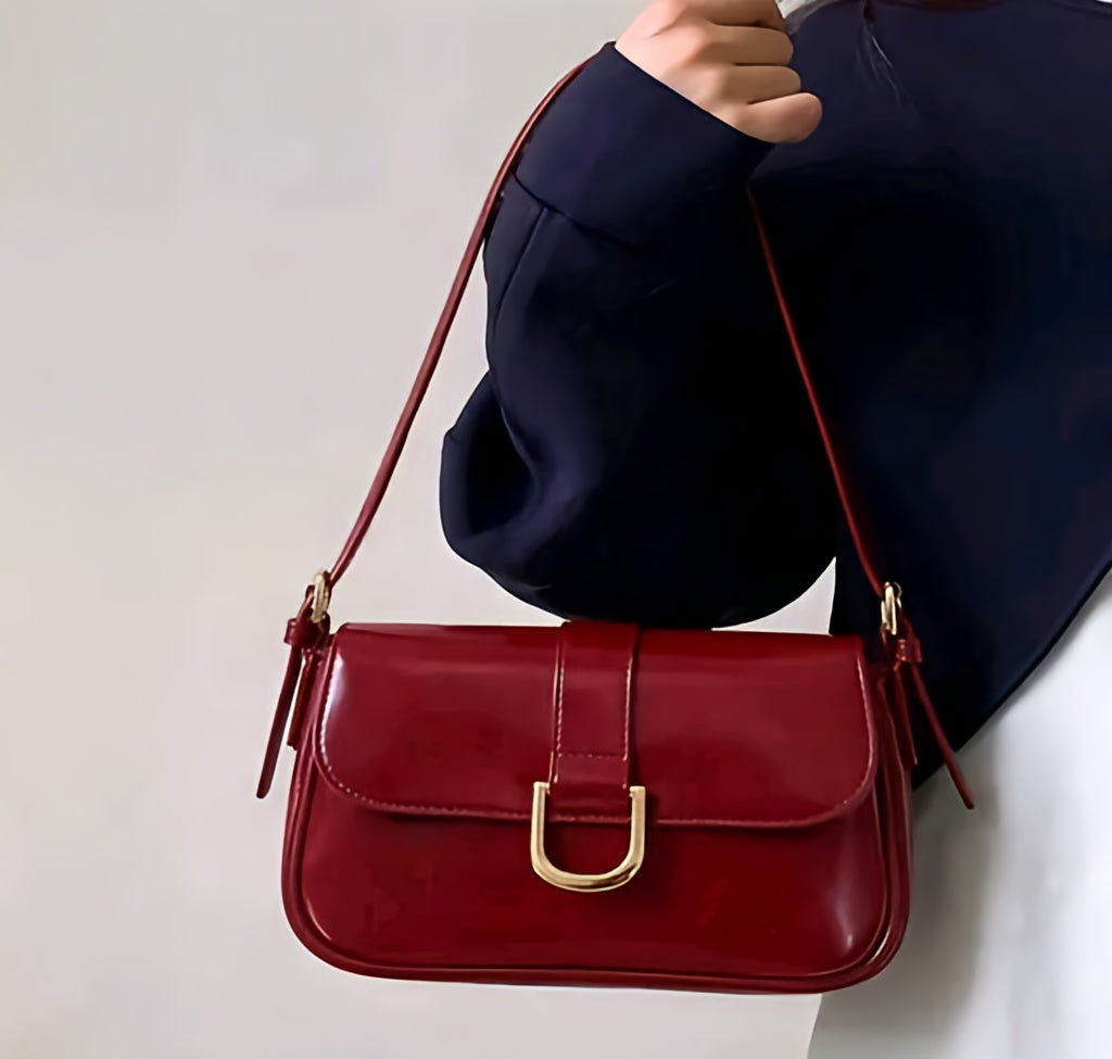 Vintage-Inspired Cherry Red Patent Leather Shoulder Bag with Gold Horseshoe Buckle
