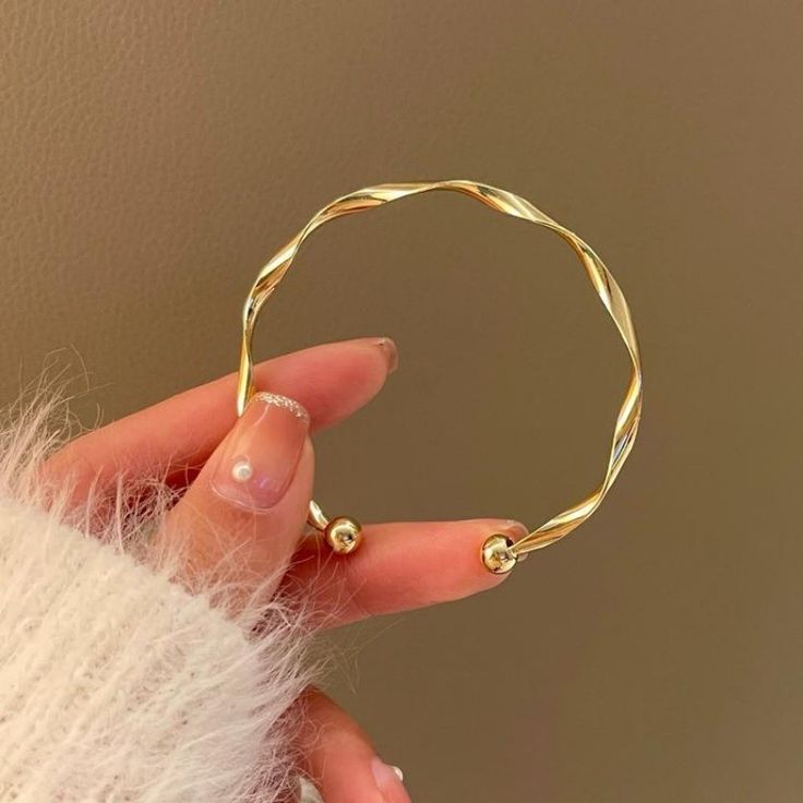 The Helix Horizon: Sculptural Twisted Bangle Duo