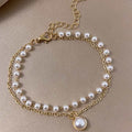 The Lumina Layer: Dual-Strand Gilded Pearl & Coin Charm Bracelet