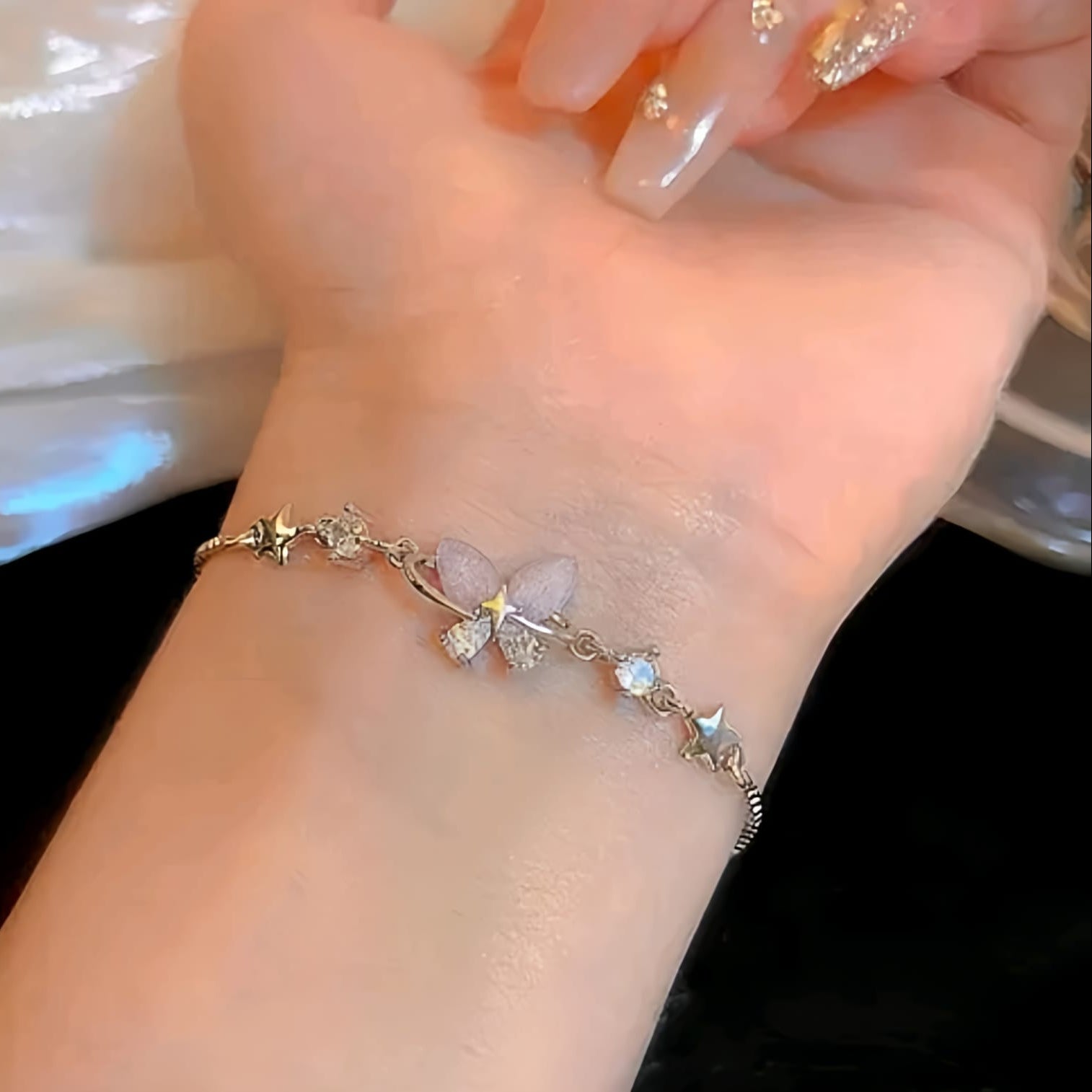 The Celestial Papillon: Gilded Butterfly & Starry Orbit Bracelet